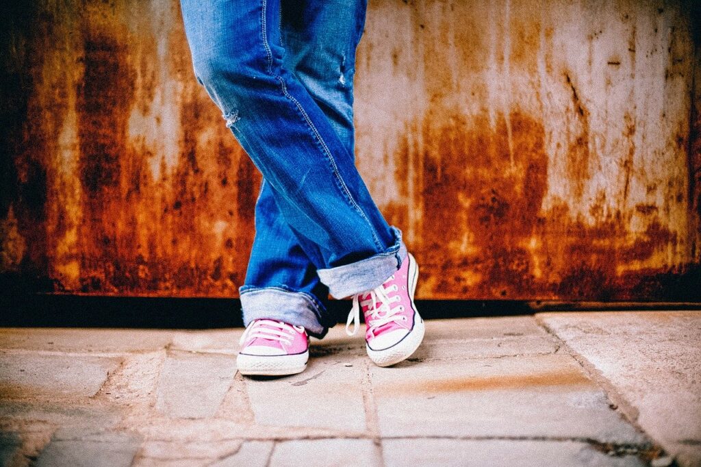 Child standing with jeans on